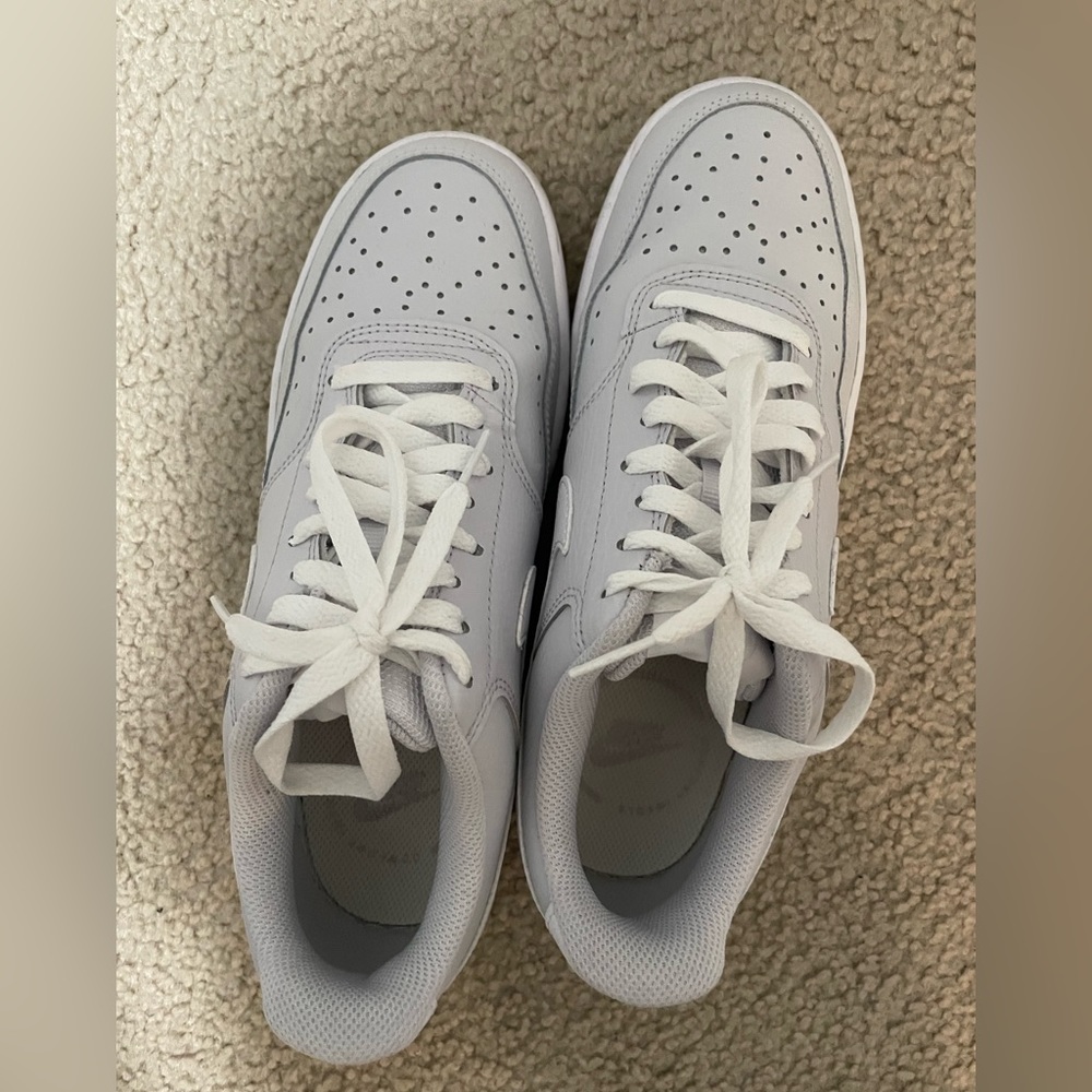 Grey and white Nike women’s court vision low sneaker